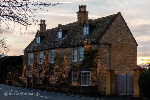 House in Broadway, Worcestershire, illuminated for Christmas