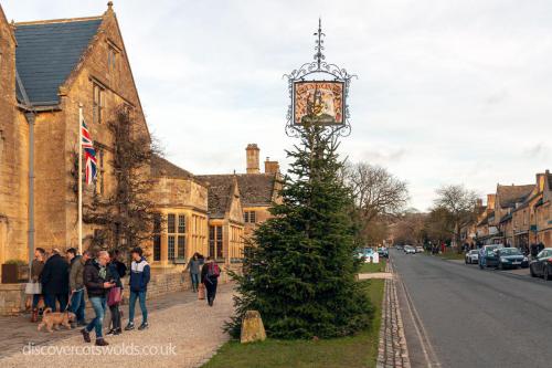 Lygon Arms Hotel, Broadway with a view of the high street and Christmas tree